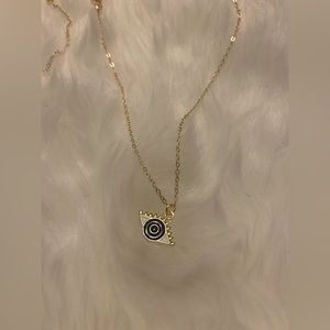 GOLD NECKLACE WITH UNIQUE CHARM